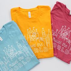 three t - shirts with the words travel the world printed on them