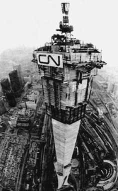 an old black and white photo of a large ship in the middle of a city