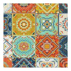 a colorful patchwork pattern with many different colors and designs on it's surface