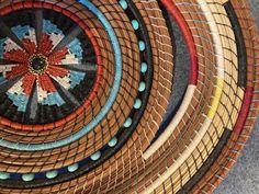 several woven baskets are arranged on the floor