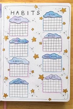 an open planner with the words habitts written on it and stars in the background