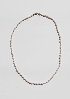 A hand knotted silk with 4mm rice pearl beads and a 14k gold clasp. Measures 16.75" long. Knotted Bead Bracelet, Hand Knotted Pearls, Clay Bead Necklace, Silk Necklace, Pearls Necklace, Stationery Accessories, Knot Necklace, Beaded Necklaces, Clay Beads