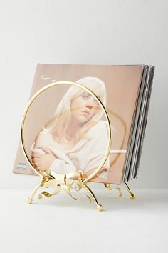 a magazine rack with magazines on it and a woman's face in the center