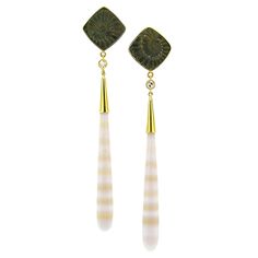 These sophisticated earrings feature fossil imprints of ancient ammonites, which have mineralized into pyrite. The drops are German-carved agate with alternating bands of creamy white and translucent peach. The rich bronze color of the pyrite and the soft tones of the agate are richly enrobed in 18kt gold. The juxtaposition of these two elegant gems elevates these luxurious earrings. -Fossil Ammonite in Pyrite (Germany) -Banded Agate (Brazil) -0.22ct Diamonds -18kt Gold -earrings measure approxi Victorian Drop Earrings, Art Deco Drop Earrings, Engraved Earrings, Platinum Earrings, Orange Agate, Luxury Earrings, Agate Earrings, Diamond Dangle Earrings, Ruby Earrings