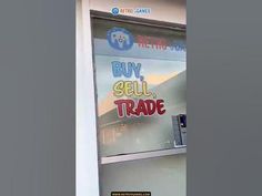 a store front window with the words buy sell trade written on it