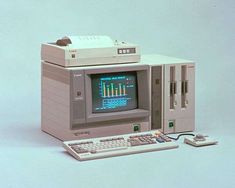 an old computer sitting on top of a table