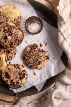 chocolate chip cookies on top of wax paper in a frying pan with salt and pepper