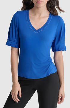 Pleats at the sleeves and silvery studs at the neckline add eye-catching details to this stretchy jersey top. V-neck Elbow-length sleeves 95% rayon, 5% spandex Machine wash, dry flat Imported Stretch V-neck T-shirt For Work, Fitted V-neck Elastane Top, Blue V-neck Elastane Top, Fitted V-neck T-shirt In Elastane, Fitted V-neck Elastane T-shirt, Fitted Elastane V-neck T-shirt, Spring Short Sleeve Elastane Blouse, Fitted V-neck Top, Pleat Sleeve