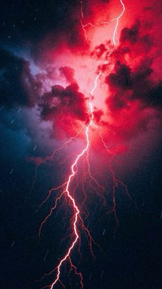 a red and blue sky with some lightning