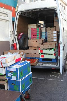 a white van filled with boxes and other items