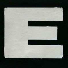 the letter e is painted black and white with an embossed font on it