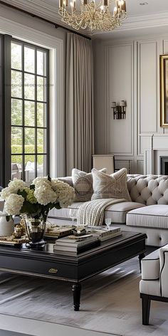 a living room filled with furniture and a chandelier above a fire hydrant