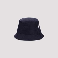 This navy nylon Jacquemus Le bob Ovalie bucket hat features a sleek, rounded crown and a wide, downward-sloping brim. Topstitched details, a side patch pocket, and silver-plated eyelets refine its modern look for casual outings.

- Composition: 100% Nylon  
- Includes slanted logo tag Navy Hats, Caged Sandals, Black Aviators, Black Tank Dress, Neon Purple, Logo Tag, Blue Hat, Balenciaga Designer, Boyfriend Tee