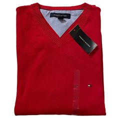 A Sleek Red V-Neck Sweater From Tommy Hilfiger: The Pristine Match For Pairing With A Collared Shirt. New With Tags. Men’s Tommy Hilfiger V-Neck Sweater New With Tags Nwt Color: Red Logo Appliqu At Left Chest Long Sleeves Ribbed Cuffs And Hem And V-Neck V-Neckline 100% Cotton (Approximate Measurements Laying Flat) Dimensions: (Pit To Pit) 24” Inches Dimensions: Cuff Opening 4” Inches Dimensions: (Length) 27 1/2” Inches *Comes From Smoke Free, Pet Free Home *Wear For: Office, Business Casual, Goi Classic Red V-neck Sweater, Classic Red V-neck Sweater For Winter, Tommy Hilfiger V-neck Winter Top, Tommy Hilfiger V-neck Tops, Red Cotton V-neck Sweater, Office Business Casual, Navy Blue Sweater, Tommy Hilfiger Sweater, Preppy Casual