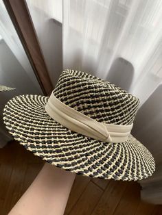 The wide brim of the hat provides excellent sun protection, shielding your face and neck from harmful UV rays. Whether you're lounging at the beach, attending a garden party, or strolling through a bustling market, this hat offers the perfect balance between style and practicality. The elegant white ribbon band adds a touch of sophistication and can be adjusted to ensure a snug fit, accommodating various head sizes. The timeless design of this straw hat makes it a versatile accessory that comple Woven Straw Hat With Short Brim For Day Out, White Straw Summer Fedora, Beige Woven Wide Brim Fedora, Cream Panama Hat With Curved Brim For Vacation, Beige Wide Brim Woven Fedora, Cream Toquilla Straw Hat For Vacation, Lightweight Fedora Straw Hat For Beach, White Toquilla Straw Boater Hat For Beach, Beige Woven Straw Hat With Curved Brim