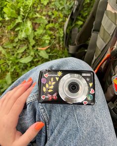 a person holding a camera in their lap