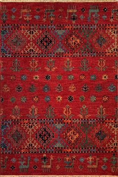 a red rug with many different designs on it