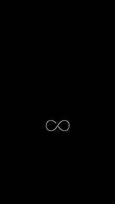 an infinite sign in the middle of a black background with only one letter visible on it