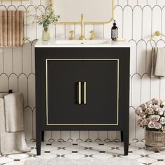 a black and gold bathroom vanity next to a white rug with flowers on the floor