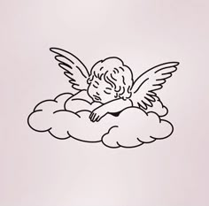 an angel sitting on top of a cloud