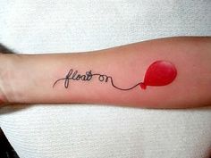 a woman's arm with a tattoo on it that says, love and an air balloon