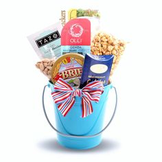 a blue bucket filled with snacks and candy