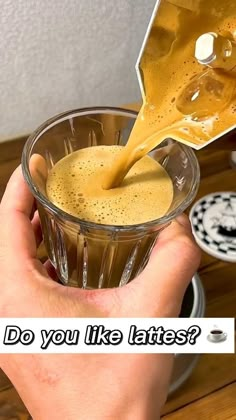 a person pouring liquid into a glass with the words do you like lattes?