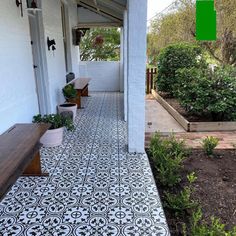 the front porch is clean and ready for us to use as an outdoor seating area