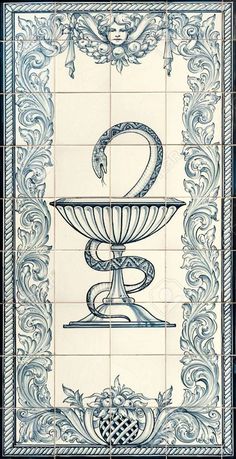 an ornate blue and white tile with a snake on it