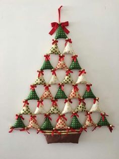 a christmas tree made out of small ornaments