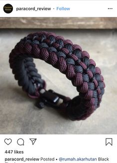 a paracord bracelet with black and purple braiding on the inside of it