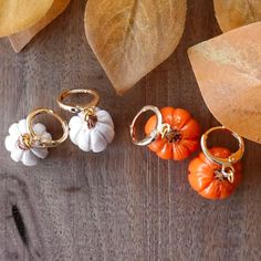 ⚘ Pumpkin Earrings - Show your love for autumn with these tiny pumpkin huggie hoops.  ⚘ Each earring in my shop is designed and handcrafted by me!  ⚘ Hypoallergenic 18k gold hardware ⚘ Lightweight polymer clay ⚘ Remove before showering or swimming ⚘ Please contact me directly with any issues regarding your order ⚘ Free Shipping on orders $35+ ⚘ Visit my shop for more cozy accessories & gifts     Thank you for visiting! ❤ https://www.instagram.com/auggie.art/  https://www.youtube.com/@auggieart Polymer Clay Thanksgiving Earrings, Thanksgiving Clay Earrings, Clay Huggie Earrings, Fall Polymer Clay Ideas, Food Polymer Clay, Autumn Earrings, Earring Inspo, Gold Pumpkins, Cozy Accessories