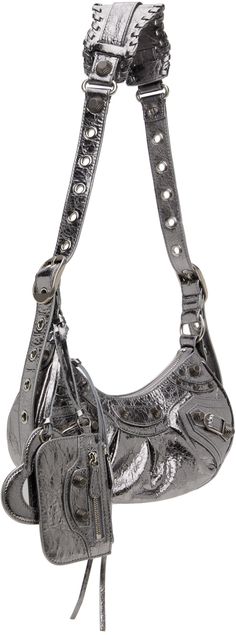 Crinkled Arena lambskin shoulder bag in metallic silver-tone. · Pin-buckle shoulder strap · Detachable zip pouch at shoulder strap · Detachable mirror · Studs and pin-buckle straps at face · Gathering at face · Zip closure · Cotton canvas lining · Antiqued silver-tone hardware · H5.5 x W10 x D2.5 in Supplier color: Silver Balenciaga Bag Strap, Balenciaga Shoulder Bag, Fancy Purses, Silver Bag, Silver Bags, Balenciaga Bag, Zip Pouch, Summer Style, Bags Women