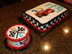 two birthday cakes sitting on top of a counter