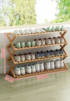 the shoe rack is holding many pairs of shoes and has two levels to hold them