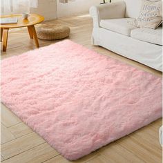 a pink area rug in a living room