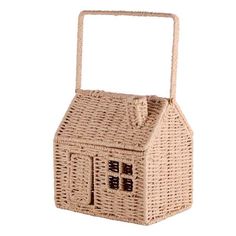 a wicker basket with a house on it