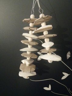 a wind chime made out of cardboard and string