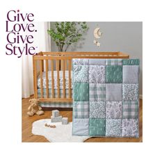 a baby crib bedding set with a teddy bear next to it