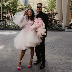 a bride and groom posing for a photo