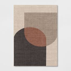 an abstract rug with brown, beige and black circles on it's surface in front of a white wall