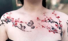 a woman with red flowers and birds on her chest