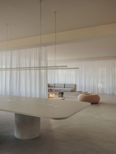 a large white table sitting in the middle of a room