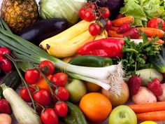 an assortment of fresh fruits and vegetables on display