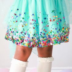 The Aqua Confetti Tutu is a fun skirt and dress up tutu for celebrating birthdays, holidays or any day! Features: Aqua tulle embellished with multicolor sequins Aqua cotton lining Gold glitter waistband Care: Hand wash and line dry The Sweet Wink difference: Super soft tulle that doesn’t scratch or itch Cotton lining provides extra coverage and comfort “Shed-free” embellishments ensure glitter does not sprinkle around the house Baby Gift Registry, Multicolor Sequins, Soft Tulle, Knee High Socks, Tutu Skirt, The Sweet, High Socks, Kids Wear, Birthday Celebration