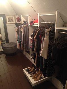 the closet is full of clothes and shoes