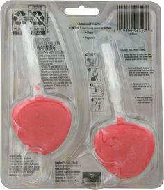 two pink toothbrushes in plastic packaging