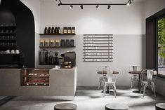 the interior of a coffee shop with tables and chairs