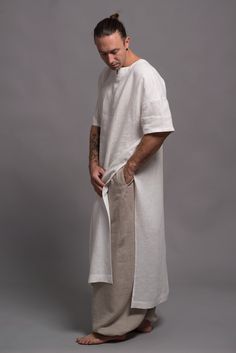 "🌿 ITEM DESCRIPTION Comfy linen tunic shirt for men. Fabric: 100% pure linen in medium weight - washed and softened. Color: Big color choice - 31 colors from the color chart (please see the pics) All SHĀNTIMA linen items come in a beautiful wrap, which makes them not only a lovely purchase but also a cool gift. 🌿 SIZING Petit, Regular, Plus Size - all our clothes come in sizes XS-3XL The model (5'9'', 174cm) is wearing size M. The color of this shirt is N9 - ANTIQUE WHITE Feel free to contact Tunic Men, Long Shirt Men, Mens Linen Outfits, Long Linen Shirt, Mens Tunic, Linen Tunic Shirt, Flax Clothing, Linen Harem Pants, Linen Shawl