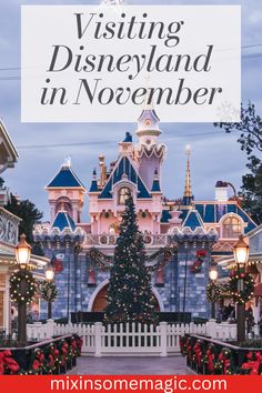 the entrance to disneyland in christmas time with text overlay saying visiting disneyland in november